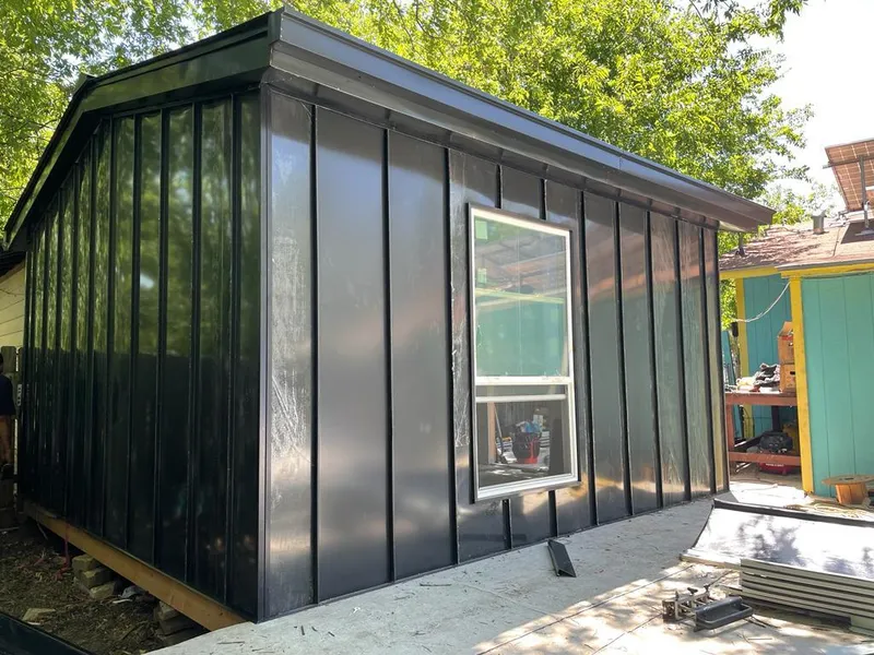 Black standing seam metal wall panels for Metal Roof Installation in Countryside